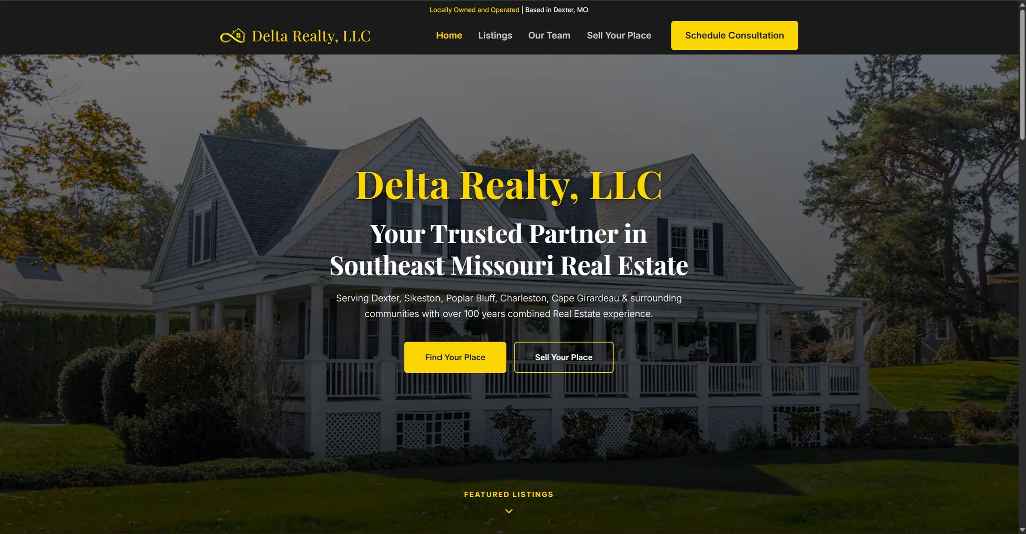 The redesigned Delta Realty homepage on desktop, showing the property search and featured listings.